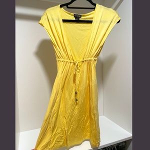 Light yellow dress or swim cover up fits (Small or Medium)